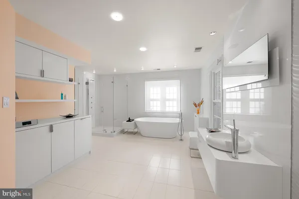 a bathroom with a sink a toilet and a bathtub