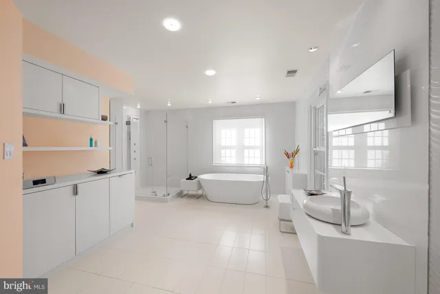 a bathroom with a sink a toilet and a bathtub