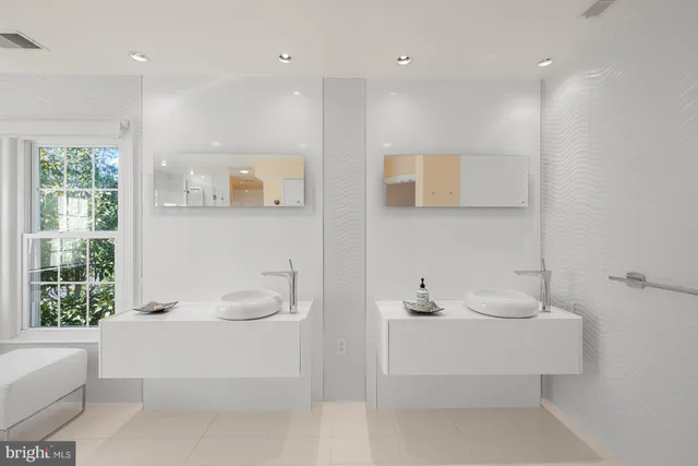 a spacious bathroom with a tub and shower