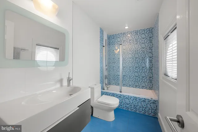 a bed room with a bed and a large window