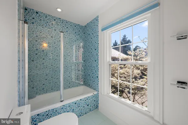 a view of storage and utility room with washer and dryer