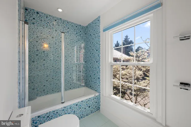 a view of storage and utility room with washer and dryer