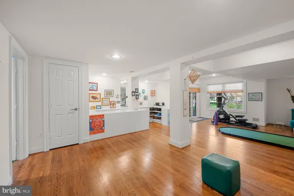 a room with green walls and stairs