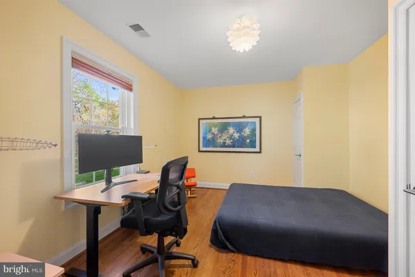 a bathroom with a sink vanity and mirror