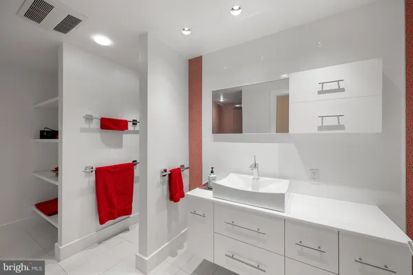 a bedroom with furniture and a potted plant