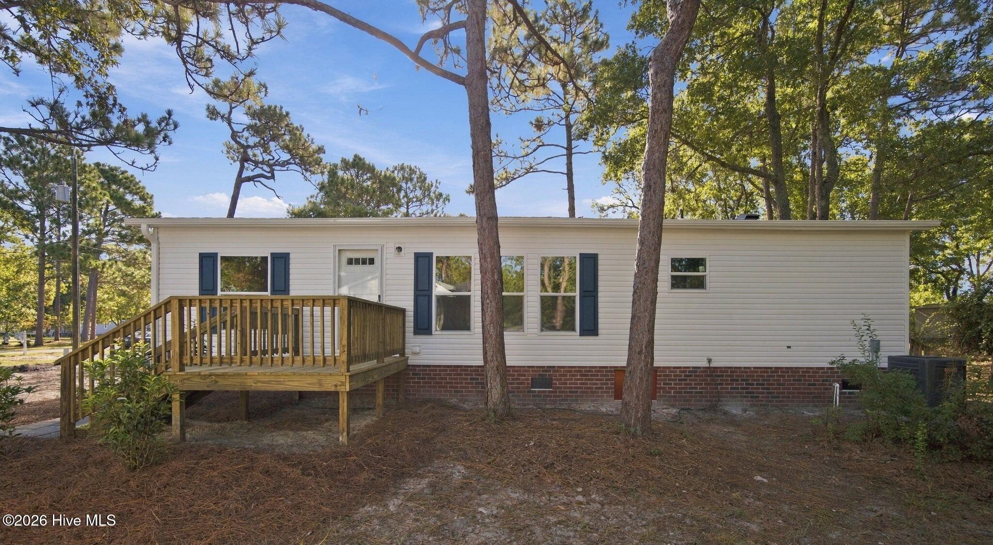 209 Sycamore Road Southport, NC 28461 - Photo 1 of 40 01_beyc6ac15a04cbf05