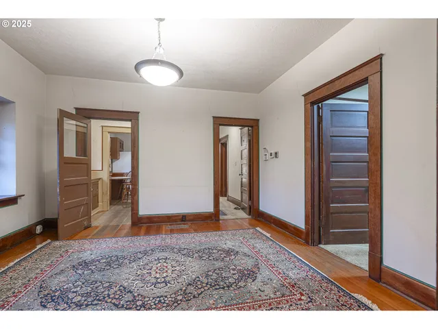 a view of a bedroom with furniture and window