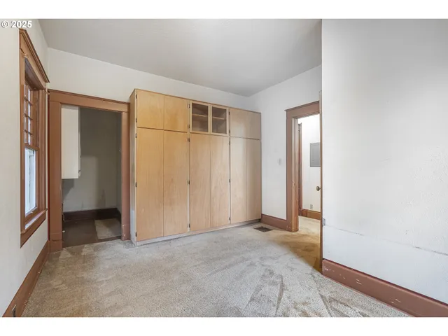 a kitchen with stainless steel appliances granite countertop a stove a sink dishwasher and cabinets with wooden floor