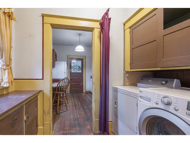 a kitchen with stainless steel appliances granite countertop a stove a sink dishwasher and cabinets with wooden floor
