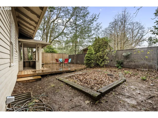 a backyard of a house with barbeque oven