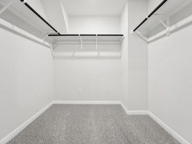 a bathroom with a shower sink and mirror