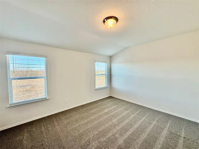 a bathroom with a sink mirror vanity and toilet