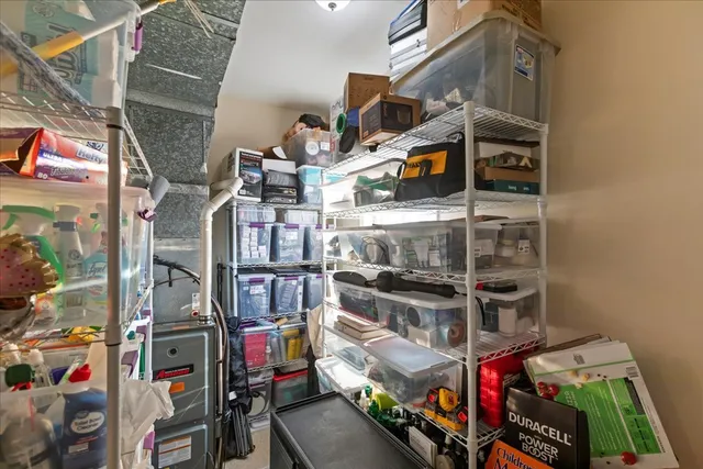 a view of a storage & utility room with a sink