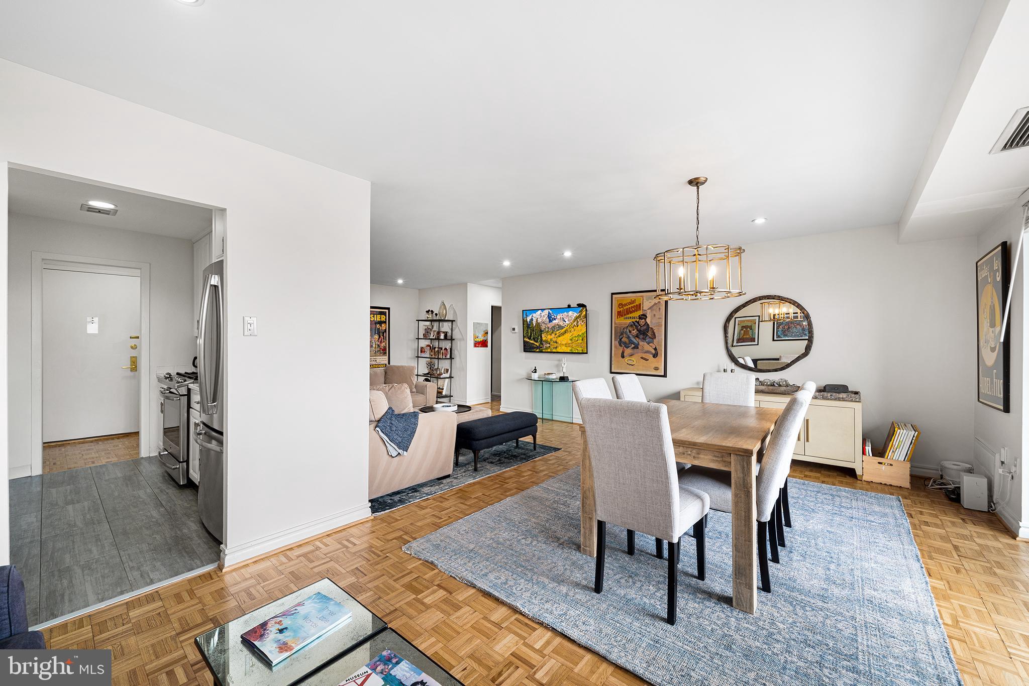 1655 Oakwood Drive, Unit N420 Narberth, PA 19072 - Photo 14 of 36 a view of a dining room with furniture and wooden floor
