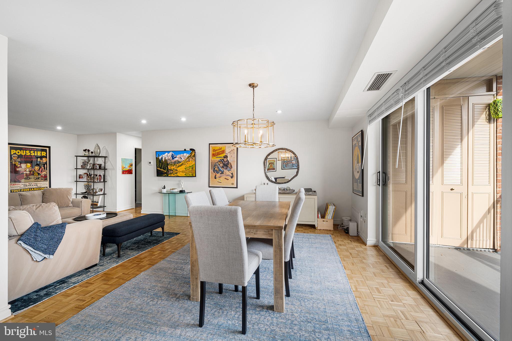1655 Oakwood Drive, Unit N420 Narberth, PA 19072 - Photo 15 of 36 a view of a dining room with furniture window and wooden floor