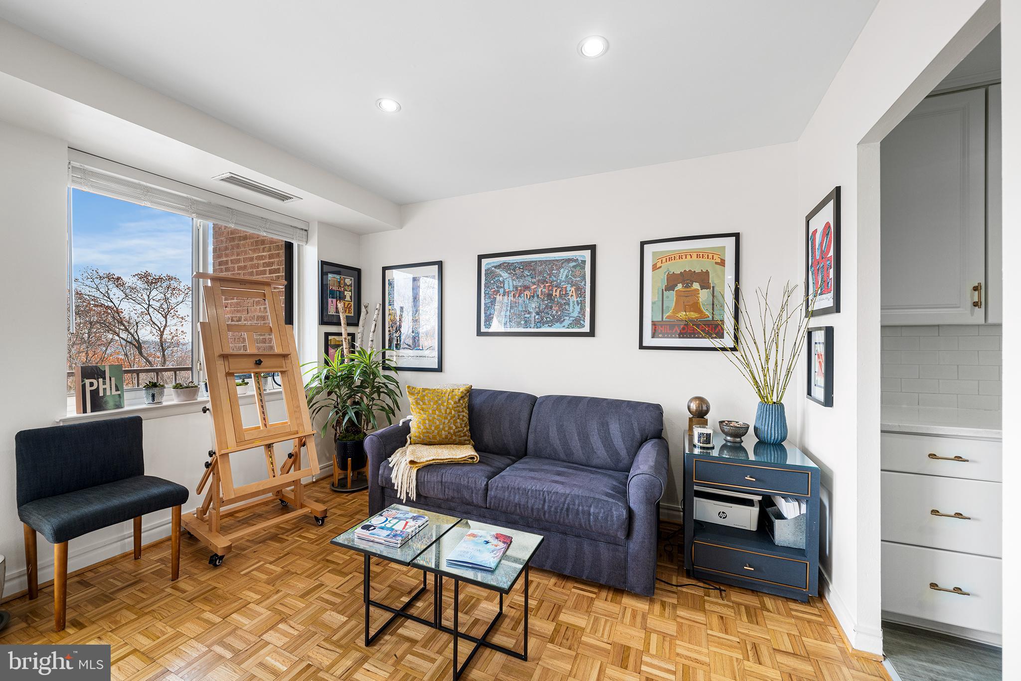 1655 Oakwood Drive, Unit N420 Narberth, PA 19072 - Photo 17 of 36 a living room with furniture and a flat screen tv