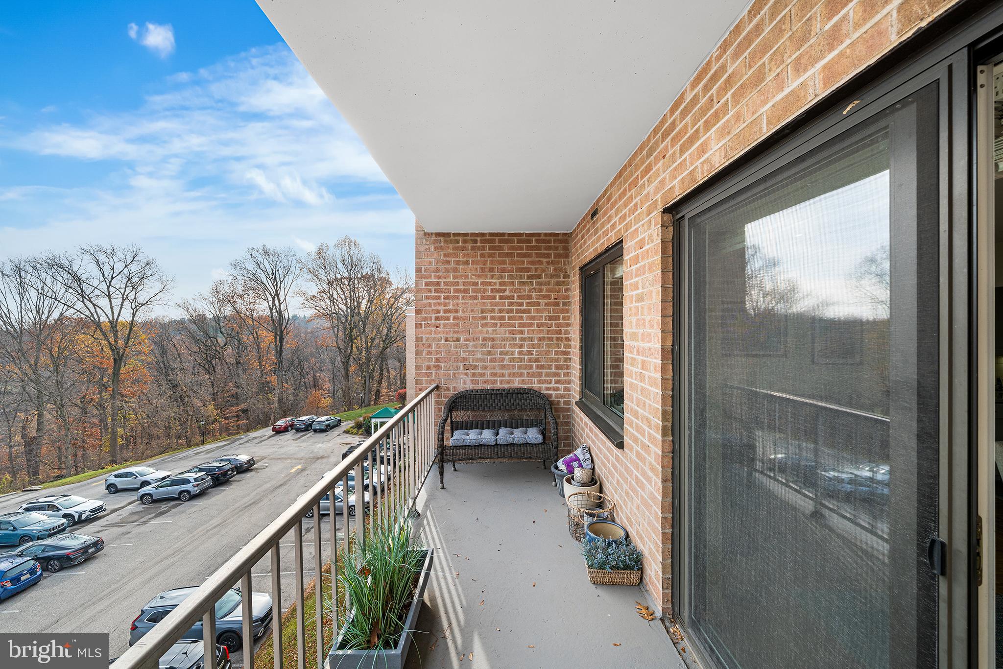 1655 Oakwood Drive, Unit N420 Narberth, PA 19072 - Photo 19 of 36 a balcony view with a lot of car parked