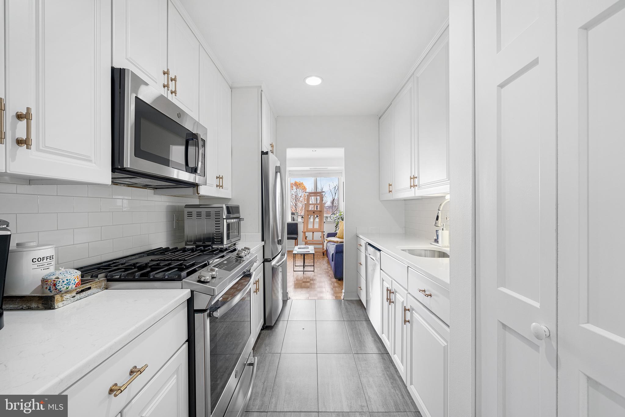 1655 Oakwood Drive, Unit N420 Narberth, PA 19072 - Photo 2 of 36 a kitchen with cabinets and appliances