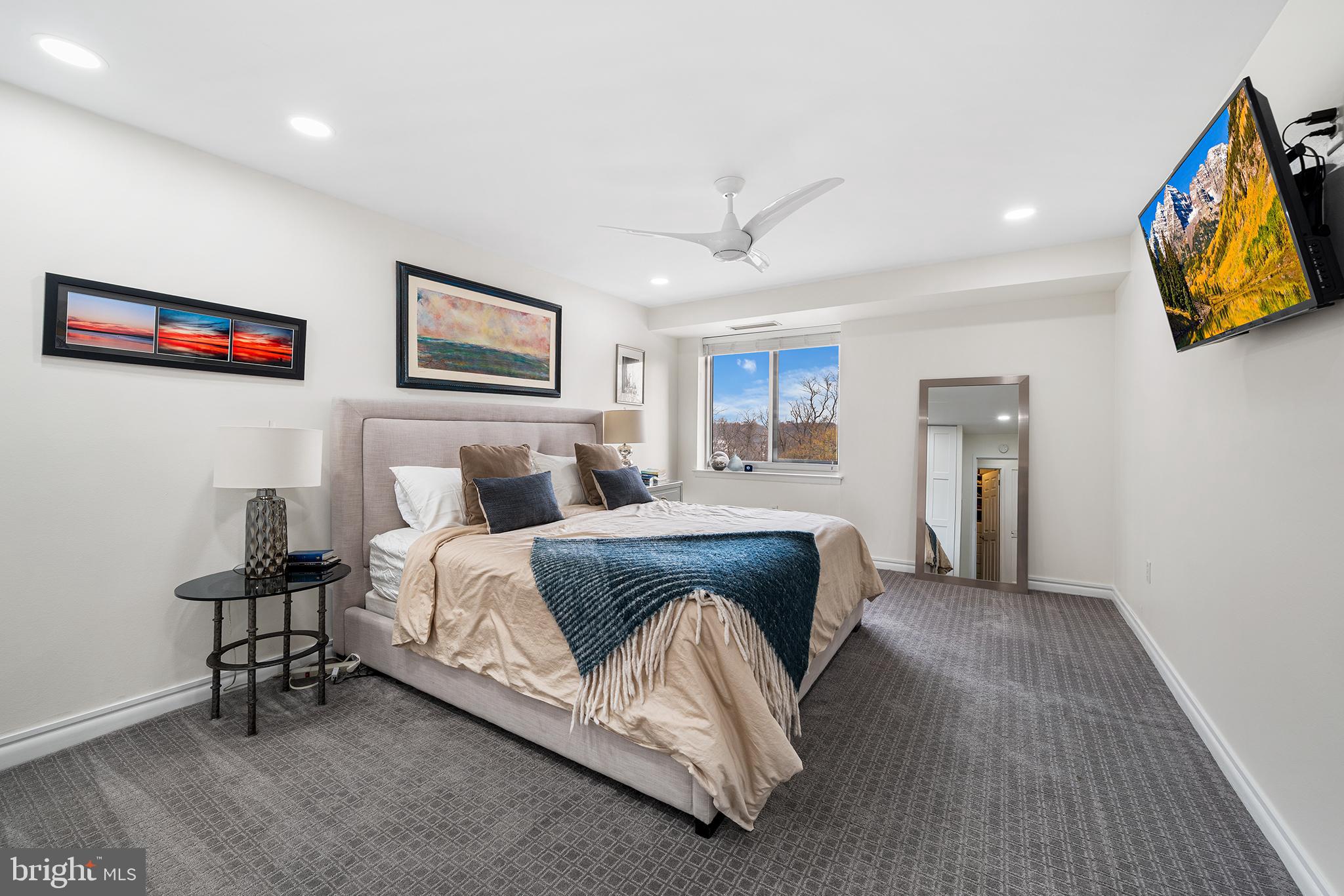 1655 Oakwood Drive, Unit N420 Narberth, PA 19072 - Photo 22 of 36 a spacious bedroom with a bed and a desk