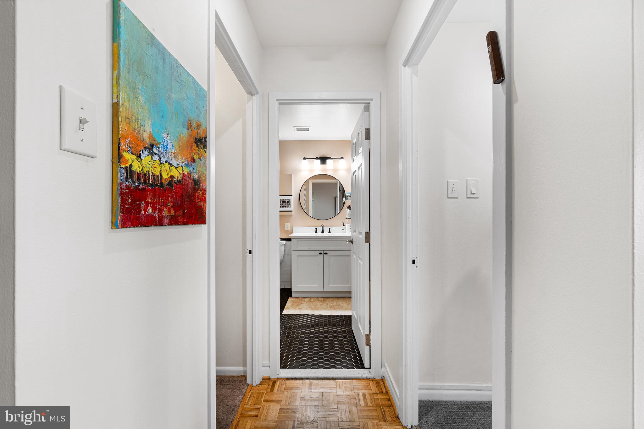 1655 Oakwood Drive, Unit N420 Narberth, PA 19072 - Photo 24 of 36 a view of a hallway with wall paintings on the wall