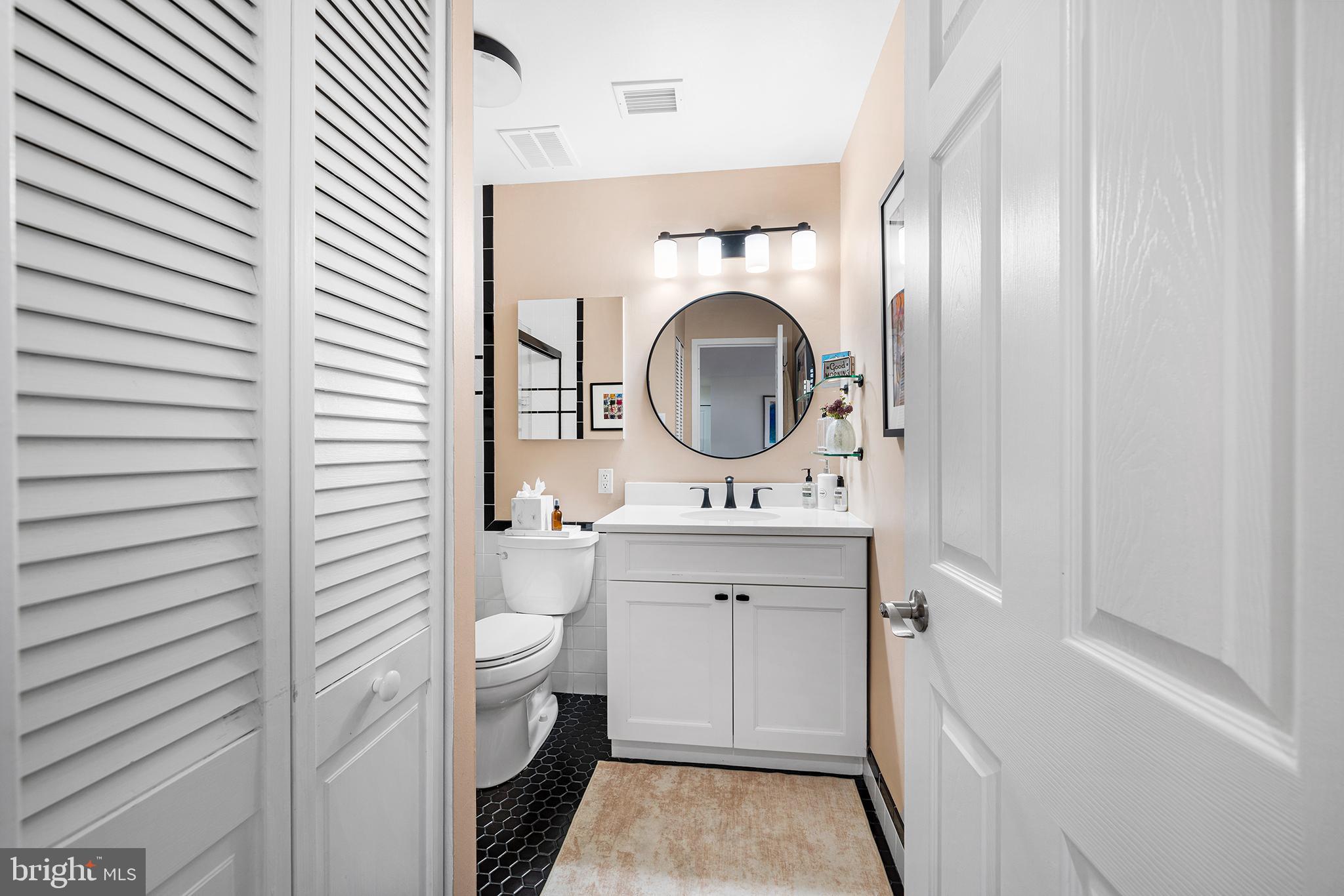 1655 Oakwood Drive, Unit N420 Narberth, PA 19072 - Photo 26 of 36 a bathroom with a toilet a sink and a mirror