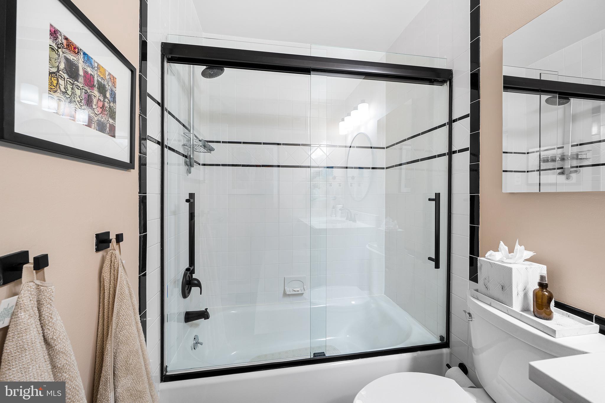 1655 Oakwood Drive, Unit N420 Narberth, PA 19072 - Photo 27 of 36 a bathroom with a bathtub and a shower