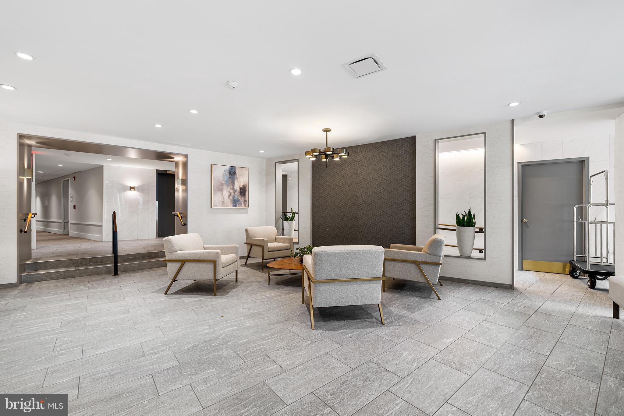 1655 Oakwood Drive, Unit N420 Narberth, PA 19072 - Photo 31 of 36 a living room with furniture and a table