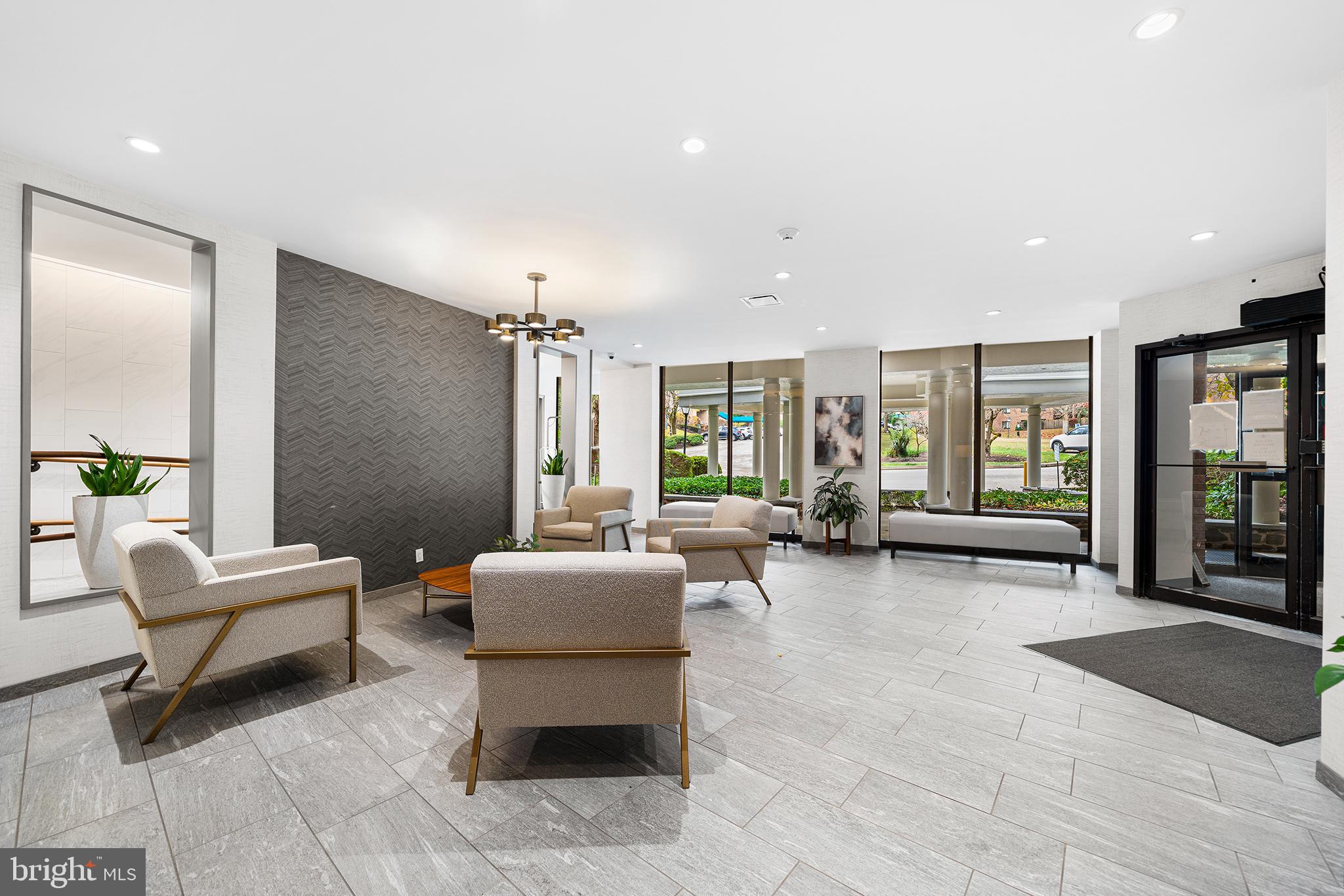 1655 Oakwood Drive, Unit N420 Narberth, PA 19072 - Photo 32 of 36 a living room with furniture and large windows