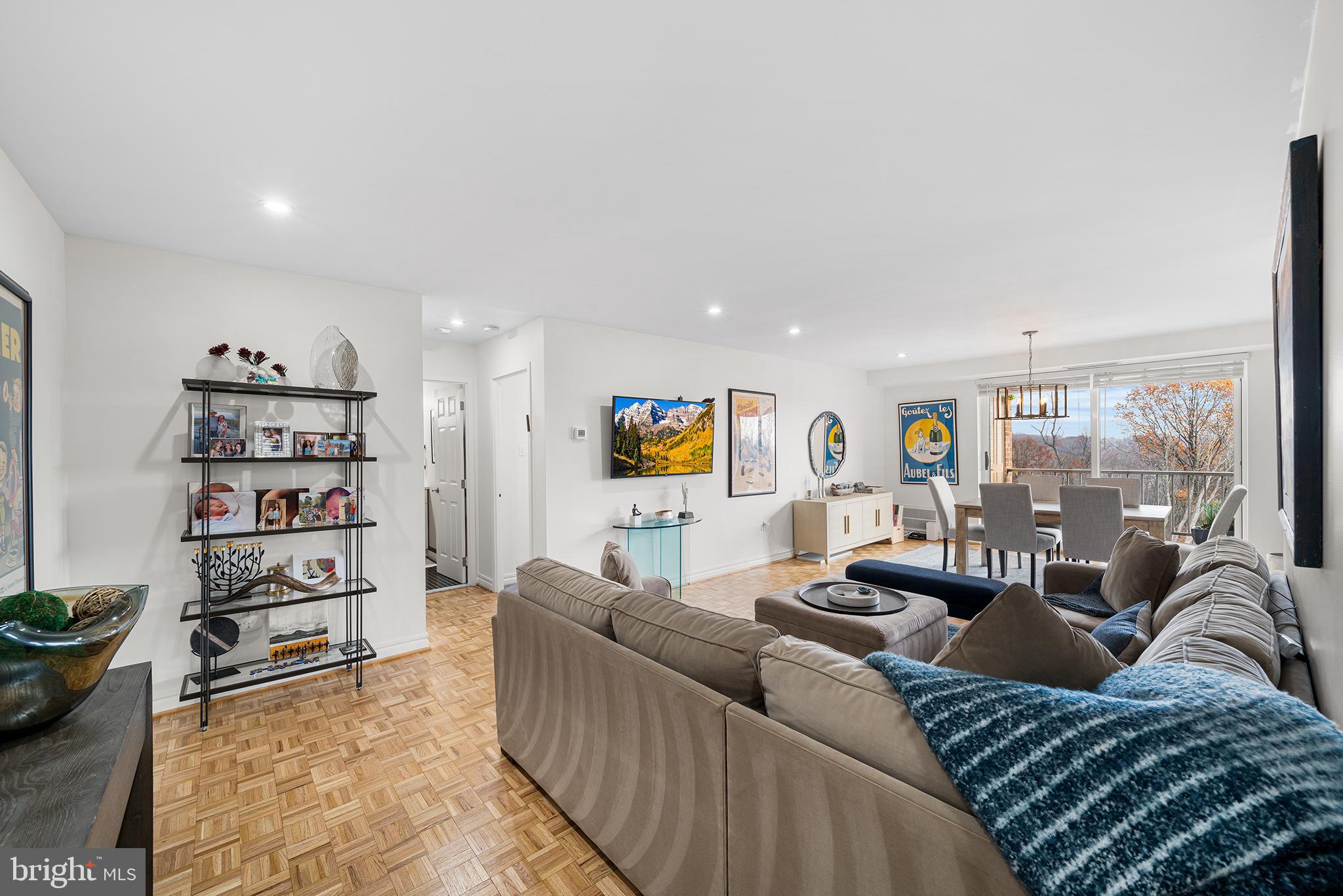1655 Oakwood Drive, Unit N420 Narberth, PA 19072 - Photo 7 of 36 a living room with furniture and a book shelf
