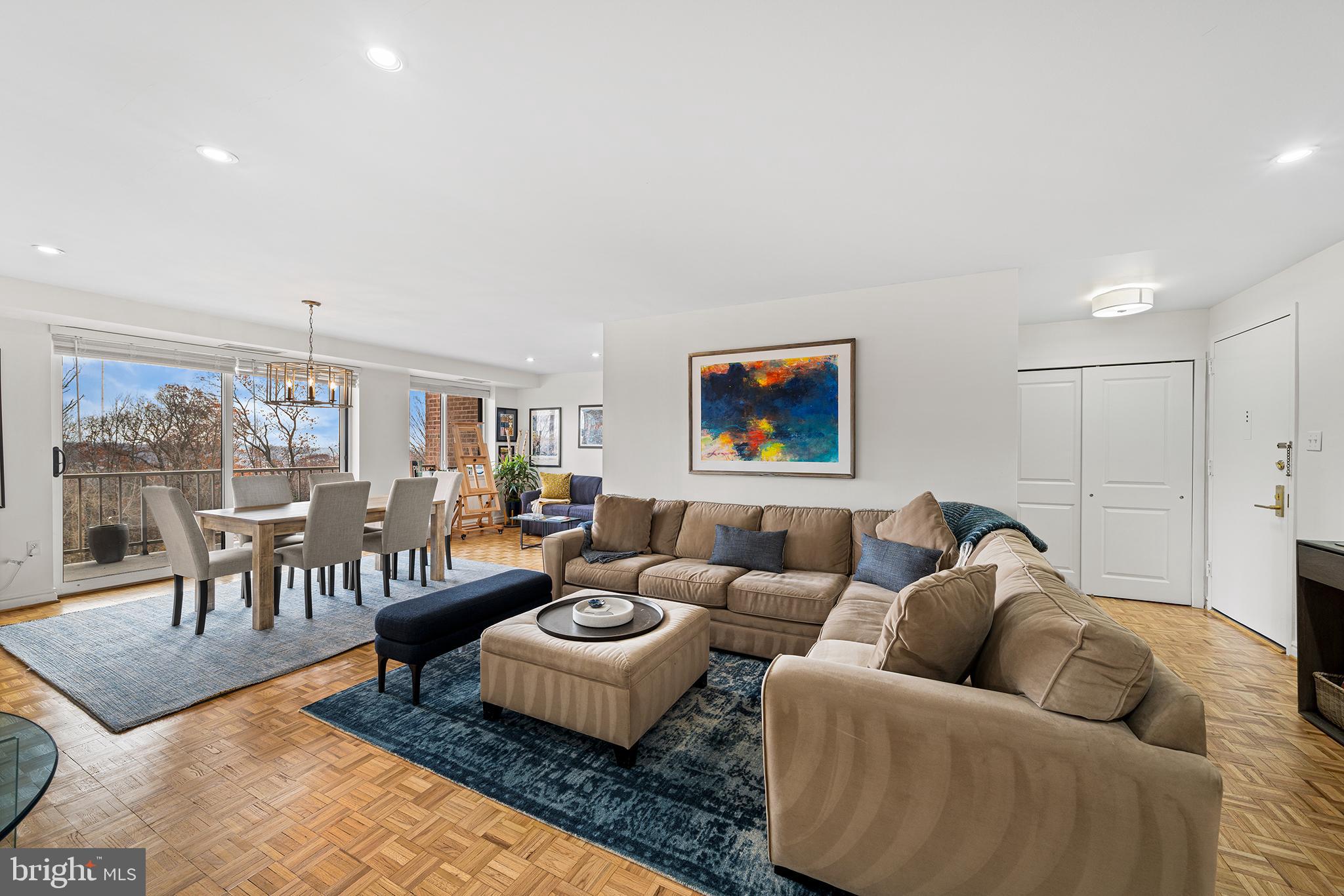 1655 Oakwood Drive, Unit N420 Narberth, PA 19072 - Photo 10 of 36 a living room with furniture wooden floor and a floor to ceiling window