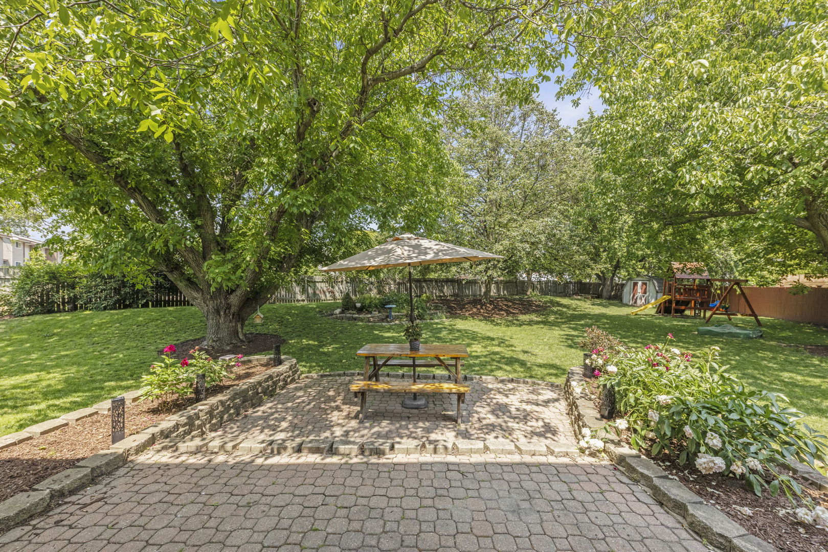 389 Pearson Circle Naperville, IL 60563 - Photo 32 of 41 a view of a garden with a bench