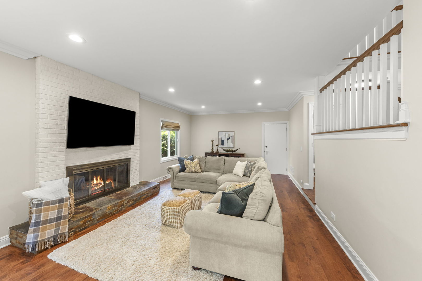 389 Pearson Circle Naperville, IL 60563 - Photo 5 of 41 a living room with furniture a flat screen tv and a fireplace