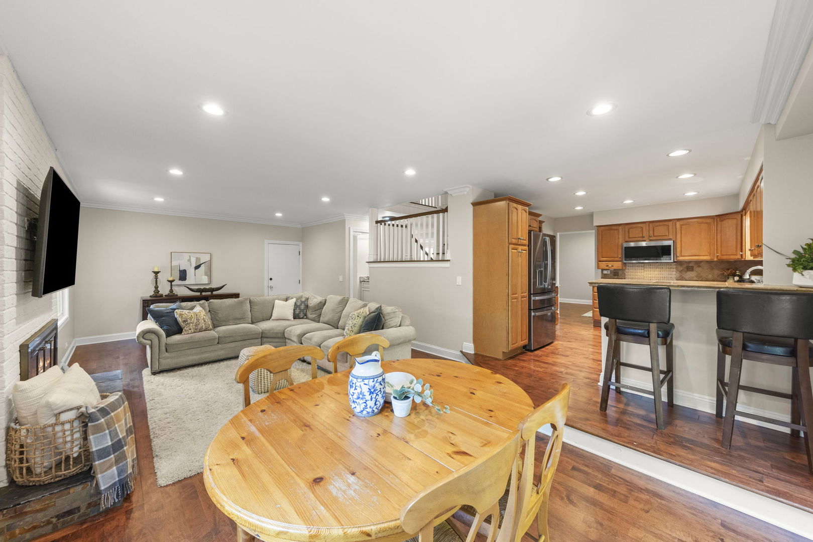 389 Pearson Circle Naperville, IL 60563 - Photo 8 of 41 a living room with stainless steel appliances furniture and a dining table with wooden floor
