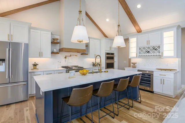 a kitchen with a stove and a refrigerator