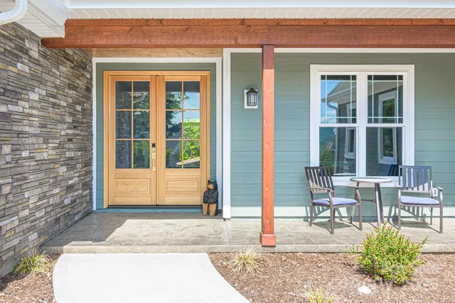 a view of a bedroom with furniture and windows