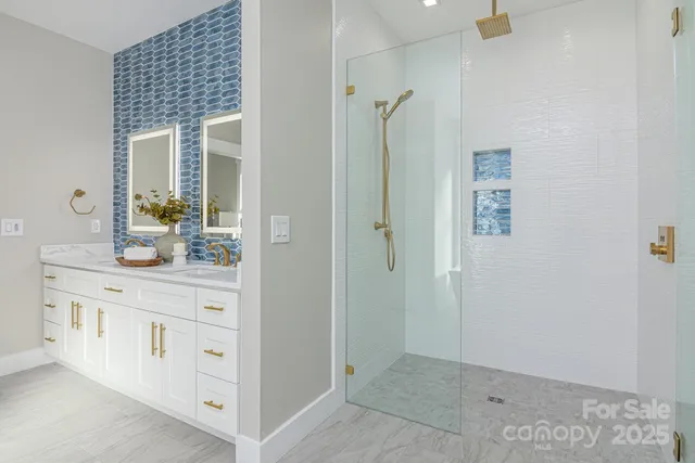a bathroom with a tub shower and sink