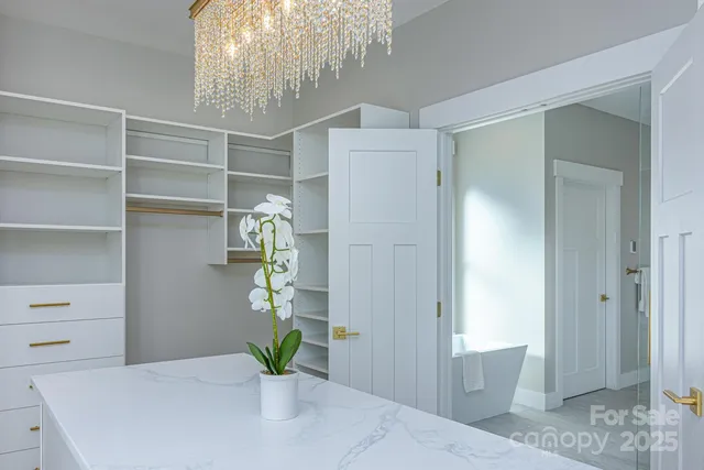 a living room with furniture a clock and a window