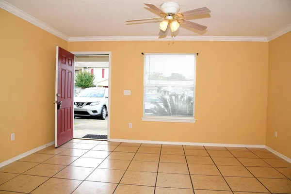 a view of an entryway and livingroom