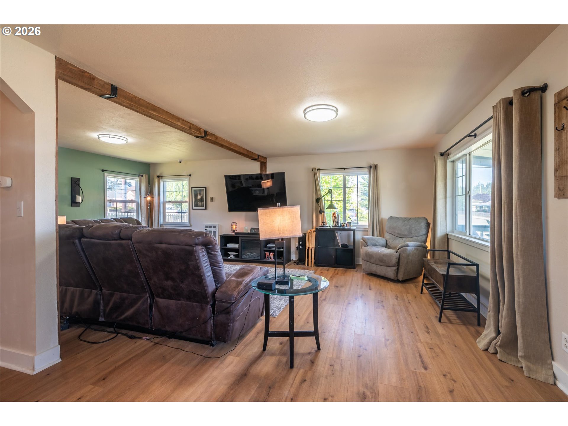 1789 14th Street North Bend, OR 97459 - Photo 21 of 43 a living room with furniture flat screen tv and couches