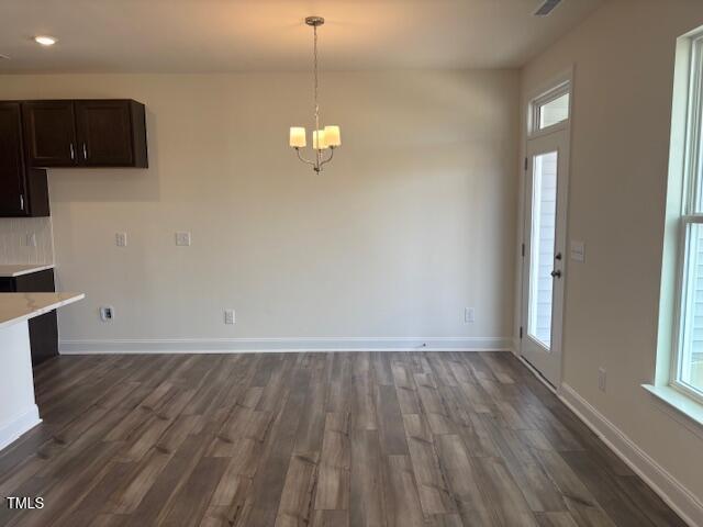 3608 Delta Drive, Unit EP 136 Wilson, NC 27896 - Photo 10 of 25 an empty room with wooden floor and windows
