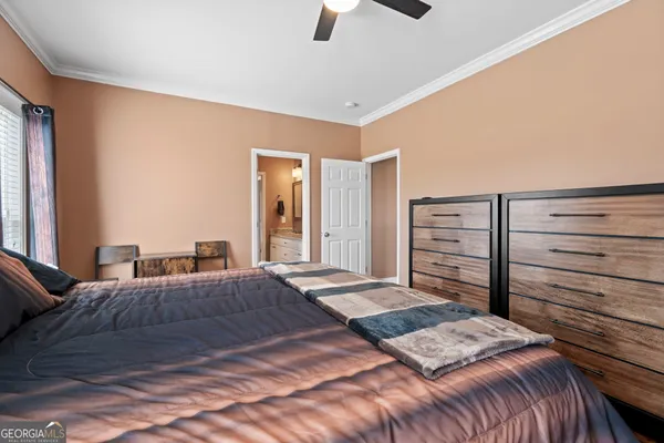 a bedroom with a bed and dresser