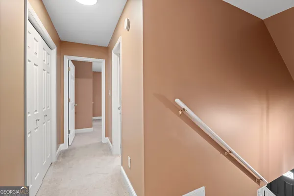 a view of a hallway with closet