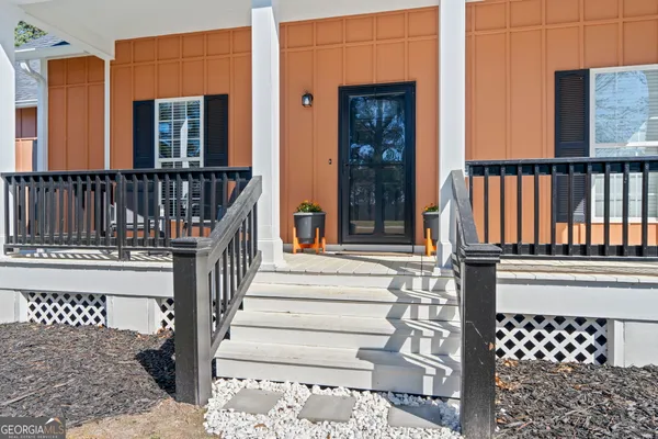 a view of a brick house with many windows