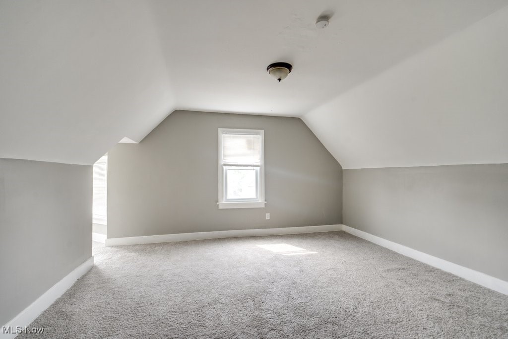 1261 Rozelle Avenue Cleveland, OH 44112 - Photo 29 of 32 Bonus room featuring vaulted ceiling and carpet