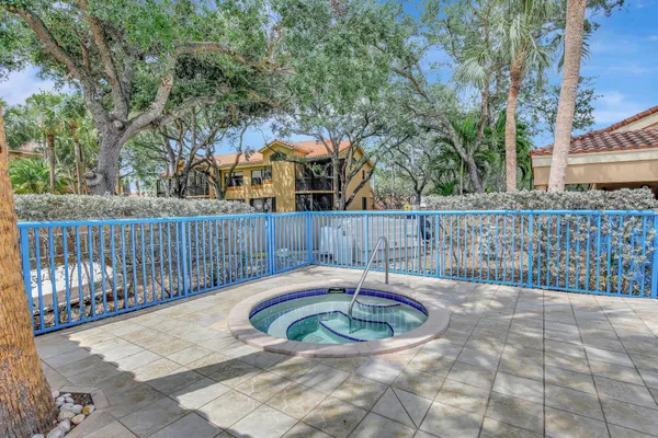 a view of a swimming pool with a patio