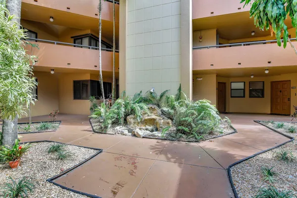 a view of a building with a yard