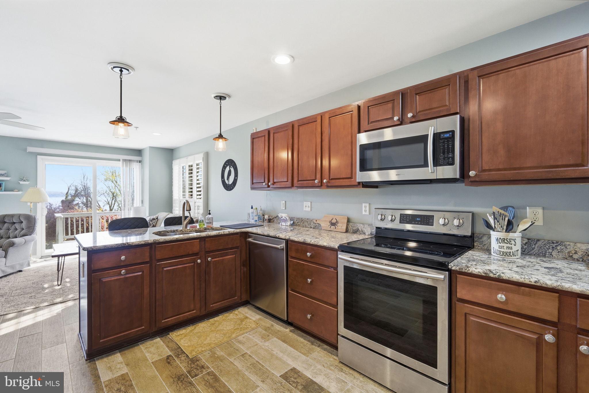 1 Idlewhile Avenue, Unit 4 Betterton, MD 21610 - Photo 33 of 43 Kitchen located between Living & Dining area