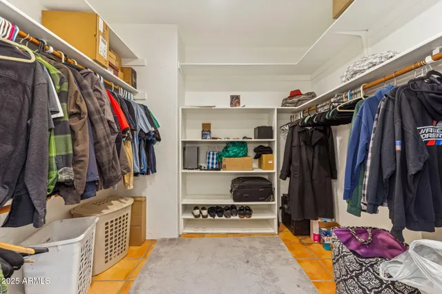 a view of a dry yard with wooden fence