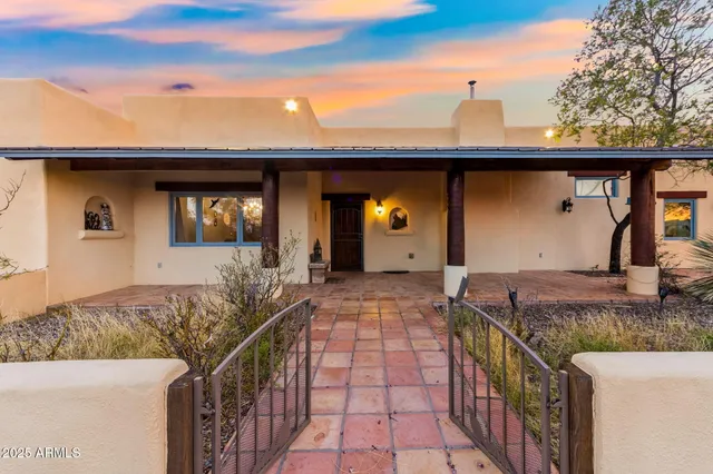 a room with pool table and glass windows