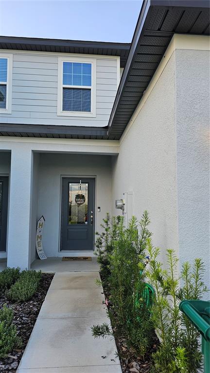 872 Poppy Lane Dundee, FL 33838 - Photo 2 of 13 a front view of a house with a yard